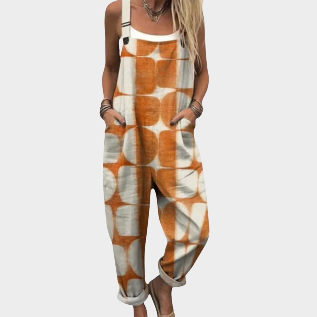 Relaxed fit overall jumpsuit with orange-and-white abstract print, bib straps and front pockets