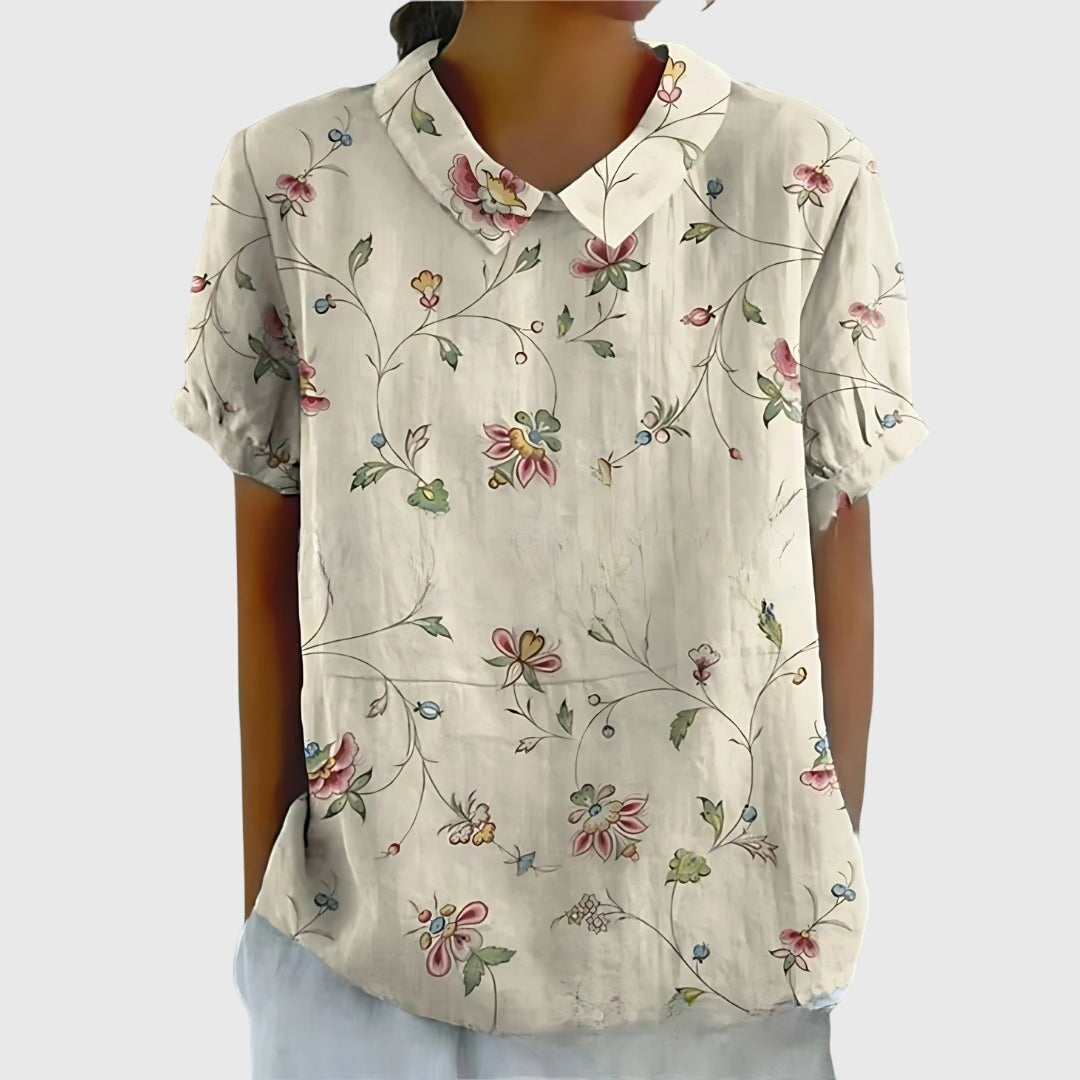 Floral collar blouse in off-white with small pink-and-blue floral vine print, short sleeves