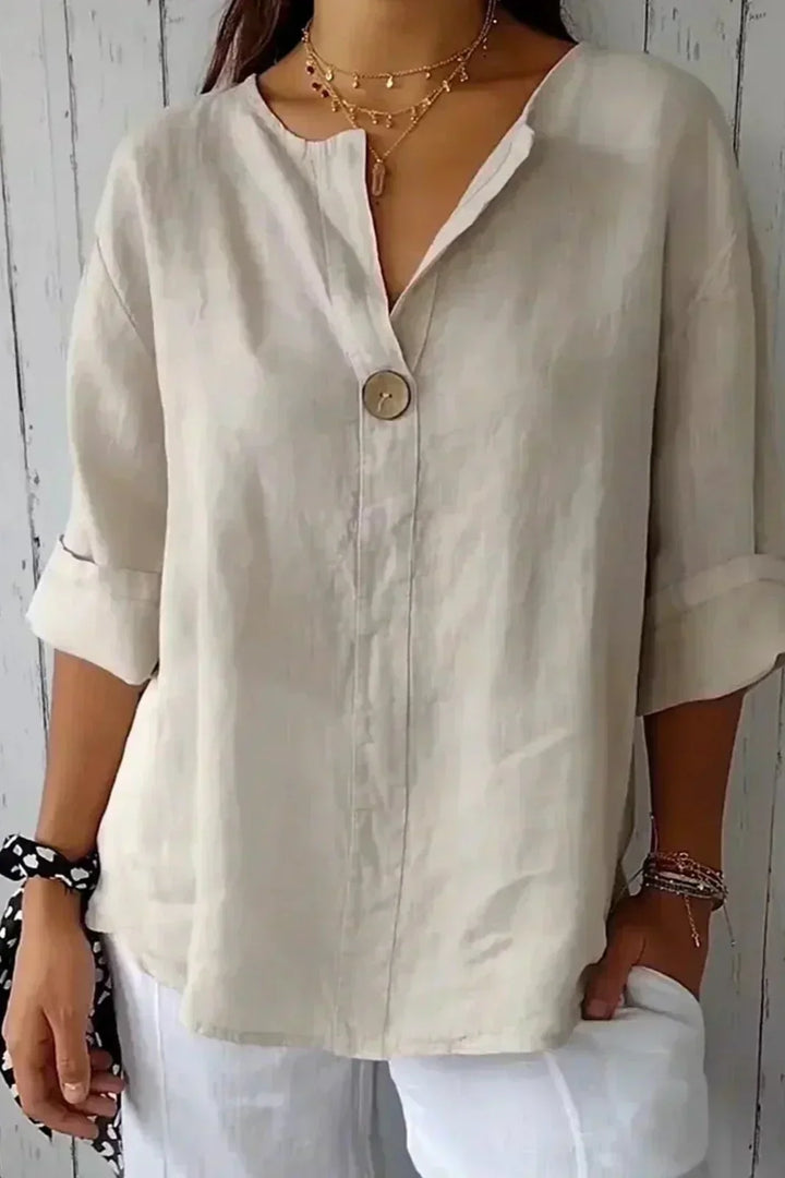 Cream minimal button blouse with V-neck, short sleeves, and single front button