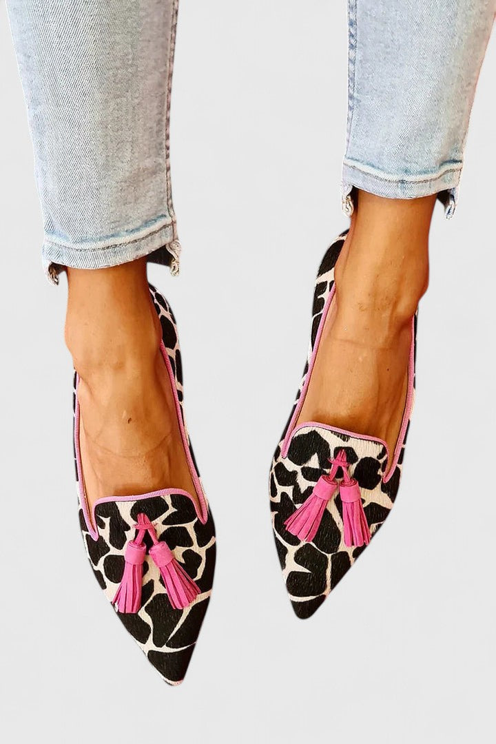 Tassel slip-on flats with pink-trim edging, leopard print upper, and pink tassels