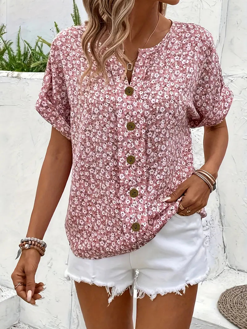 Pink floral button blouse with open collar and decorative buttons, short sleeves