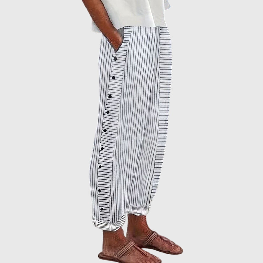 Blue striped button-front pants with roomy fit and buttoned side placket detail