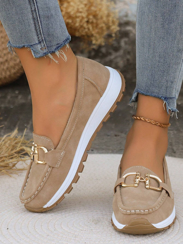 Khaki chain-detail slip-on loafers with gold hardware and contrast white outsole.