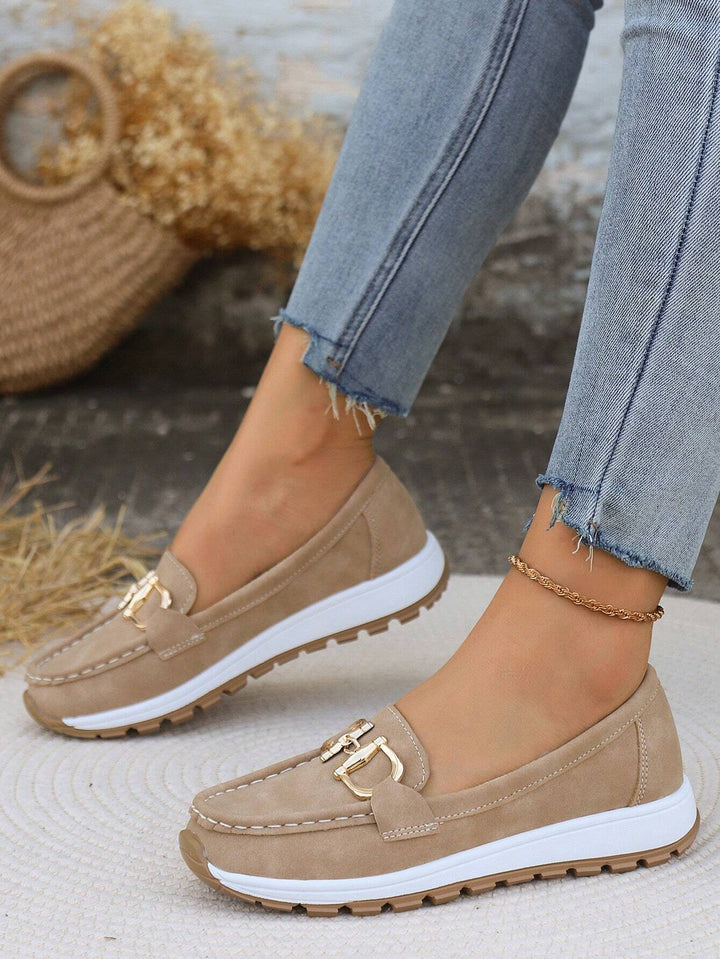 Khaki chain detail slip-on loafers with gold buckle accent and low-profile white sole.