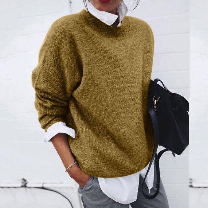Khaki knit crewneck sweater with ribbed neckline and long sleeves.