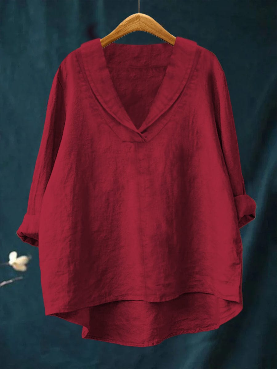 Red relaxed linen blouse with V-neck and loose fit, long sleeves, draped hem.