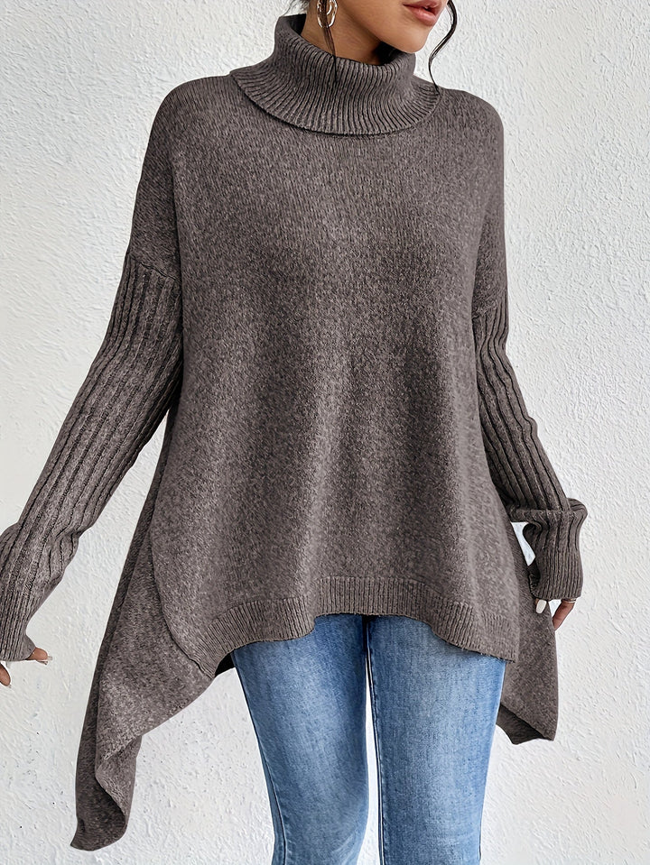 Dark gray knit turtleneck sweater, oversized silhouette with ribbed cuff details.