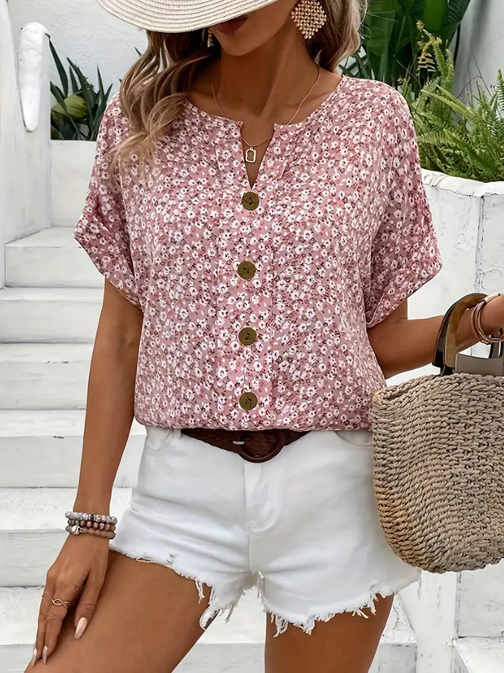 Pink floral button blouse with V-style front opening and short puff sleeves
