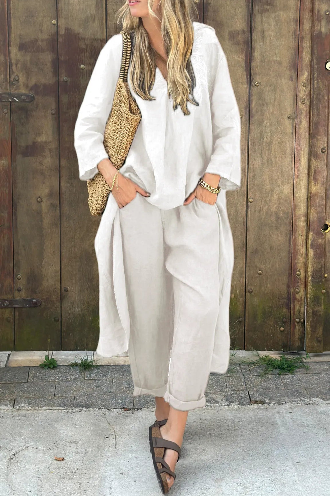 White two-piece lounge set with V-neck tunic top and cropped wide-leg pants