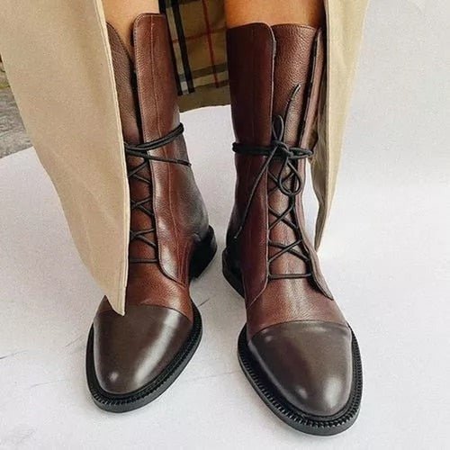 Brown lace-up ankle boots with metal eyelets and cushioned ankle collar