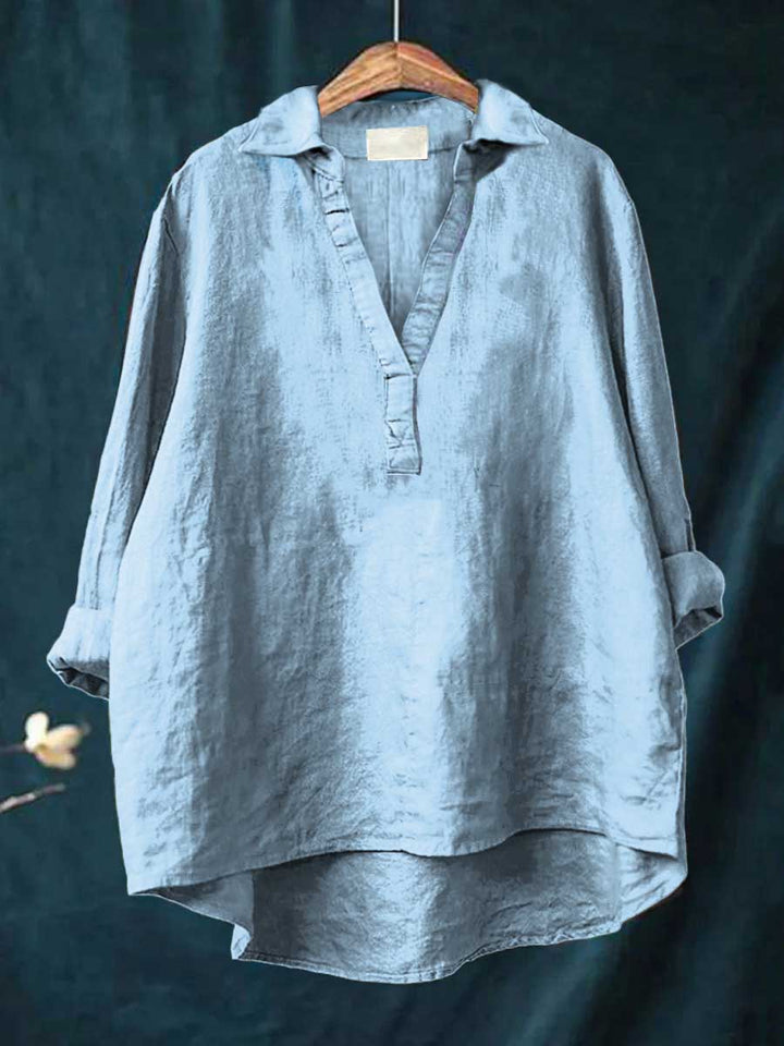 Light blue linen blouse with V-neck and short button placket, relaxed fit