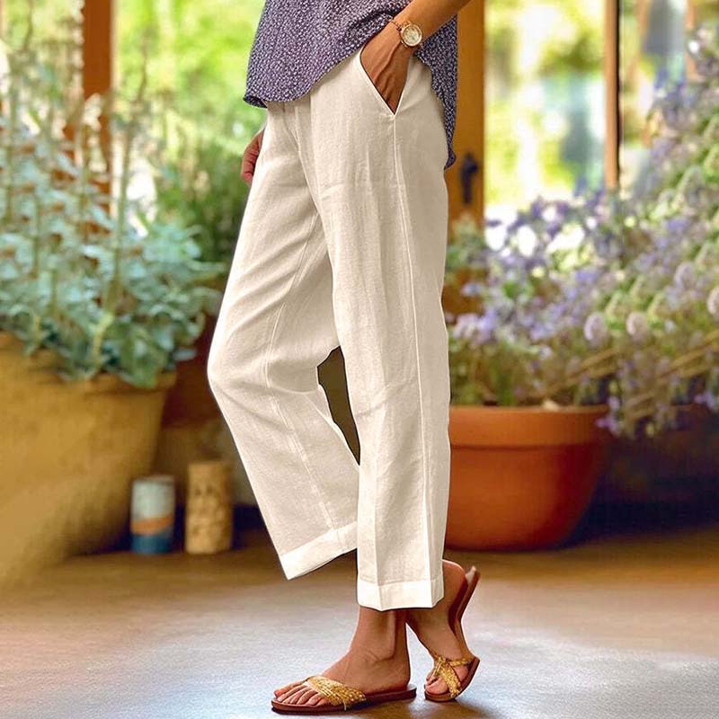 Relaxed summer pants, off-white wide-leg trousers with side vents and ankle cuffs.