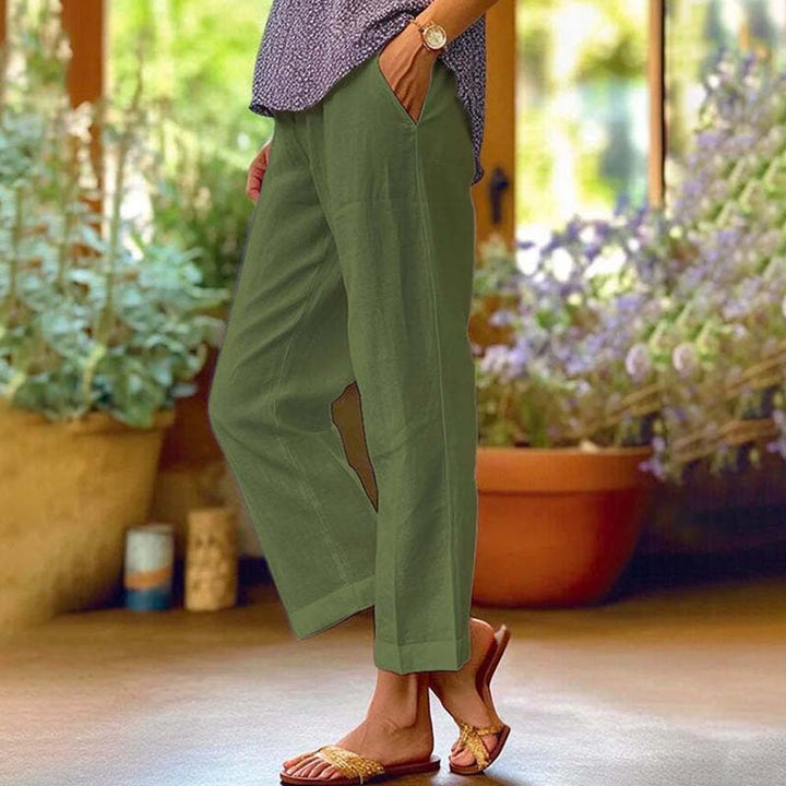 Relaxed summer pants, army green wide-leg trousers with side vents and ankle cuffs.