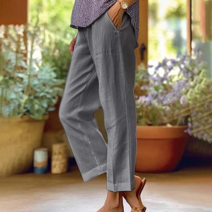 Relaxed summer pants, gray wide-leg trousers with side vents and ankle cuffs.