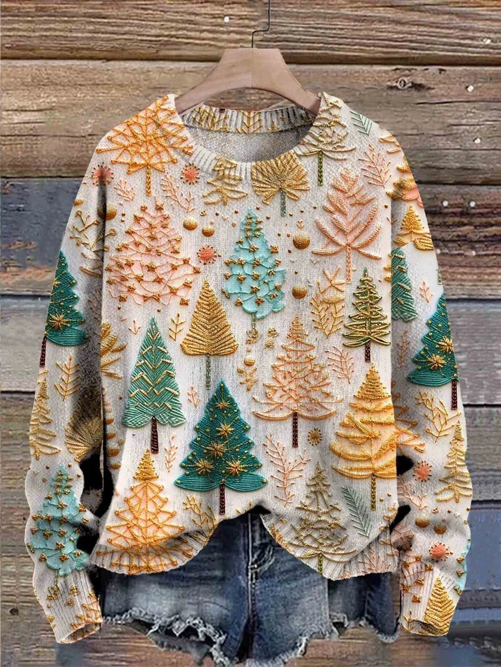 Off-white knit sweater with multicolor tree and star motifs, ribbed crew neck