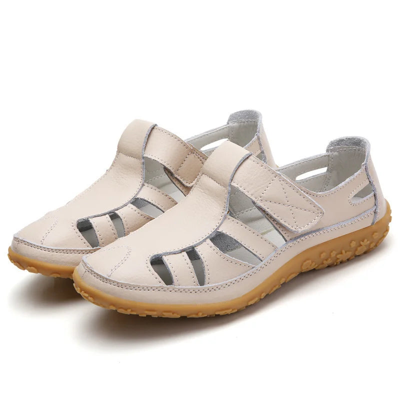 White orthopedic anti-slip sandal with hook-and-loop straps and textured rubber sole