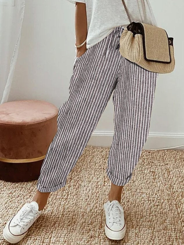 Gray striped relaxed drawstring pants with cuffed hem and adjustable waist tie.