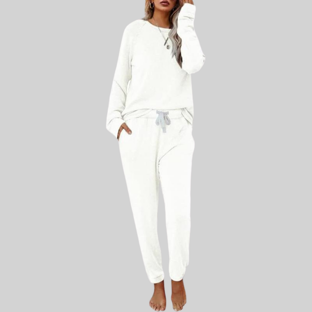 White cozy lounge set: crewneck long-sleeve top and jogger pants with white drawstring.