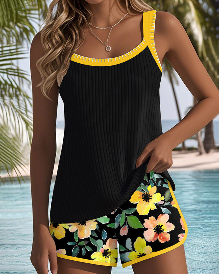 Black ribbed tankini set with yellow trim and floral shorts