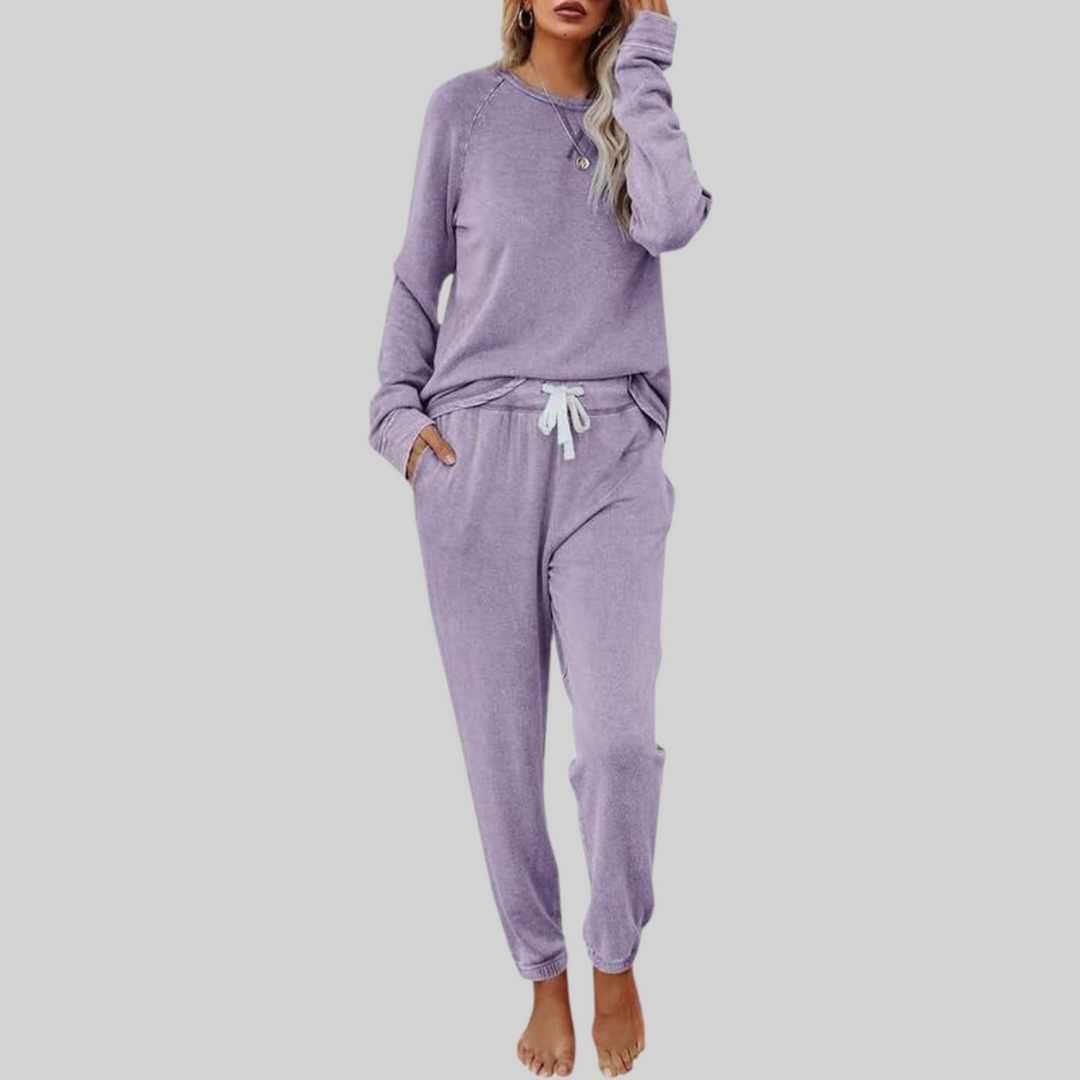 Purple cozy lounge set: crewneck long-sleeve top and jogger pants with white drawstring.