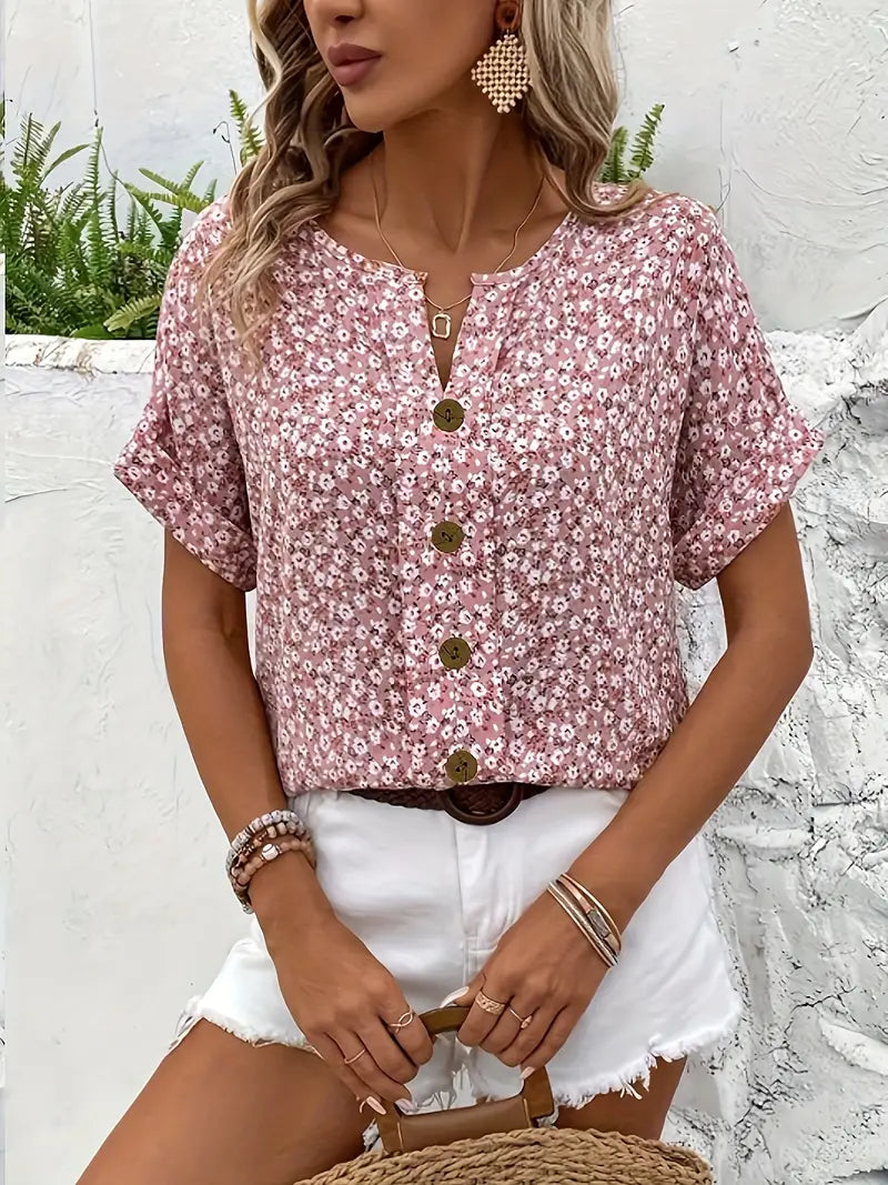 Pink floral button blouse with round neckline, keyhole placket, and short sleeves