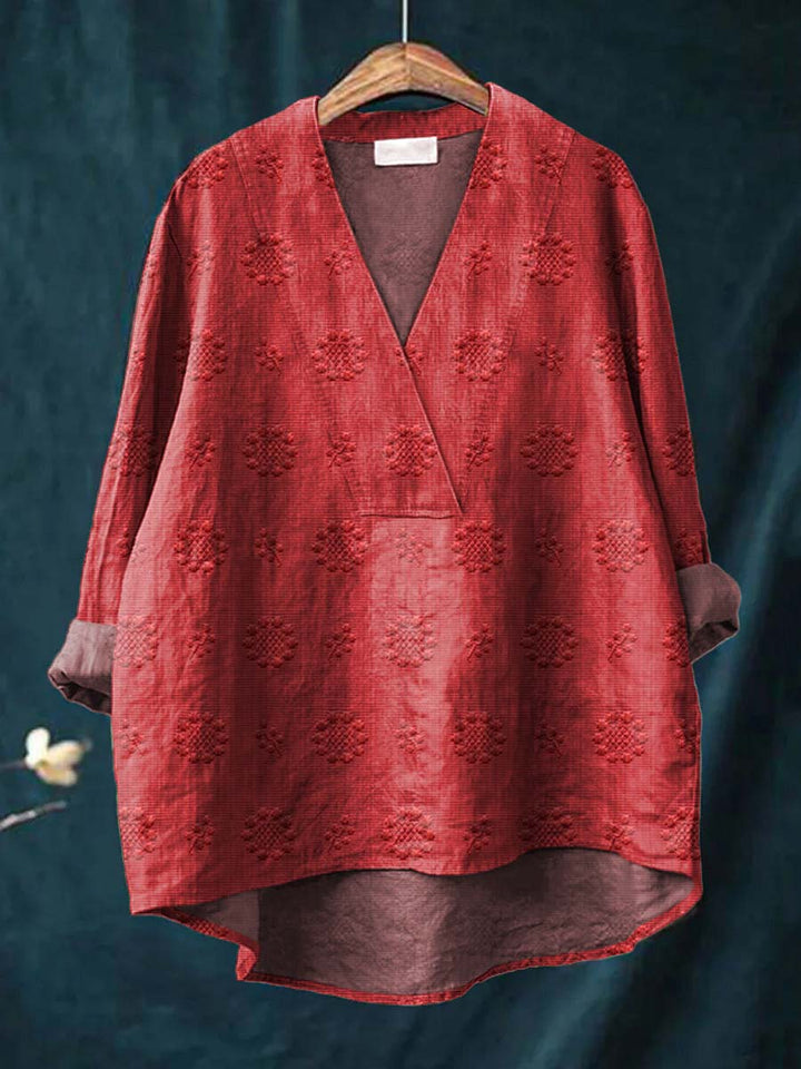 Red linen blouse with V-neck and all-over floral embroidery, relaxed drape