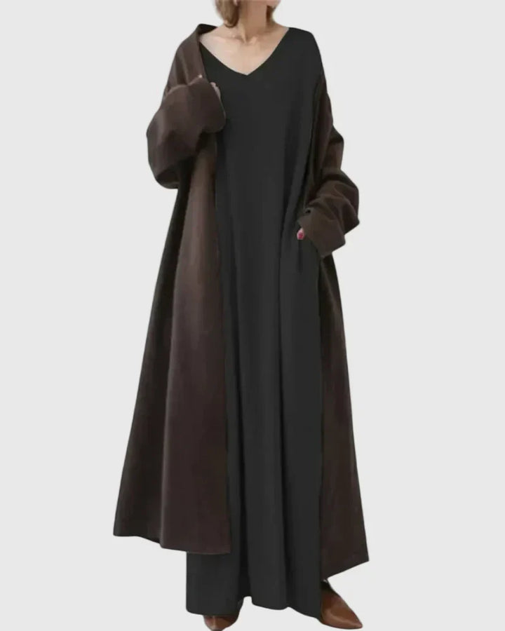Relaxed cocoon maxi dress, black V-neck, long sleeves, side slit hem with dark drape