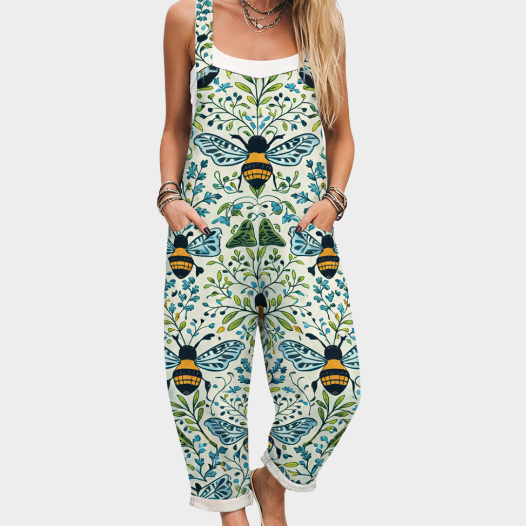 Relaxed fit overall jumpsuit in light cream with blue and green insect print, sleeveless