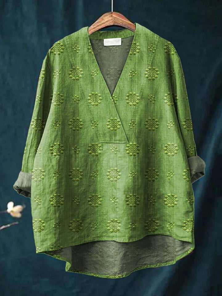 Green linen blouse with V-neck and all-over floral embroidery, relaxed fit