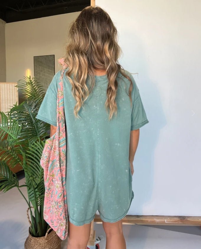 Washed pocket romper, teal, short sleeves, back view with patch pockets