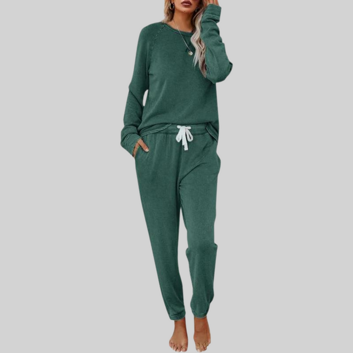 Dark green cozy lounge set: crewneck long-sleeve top and jogger pants with drawstring.
