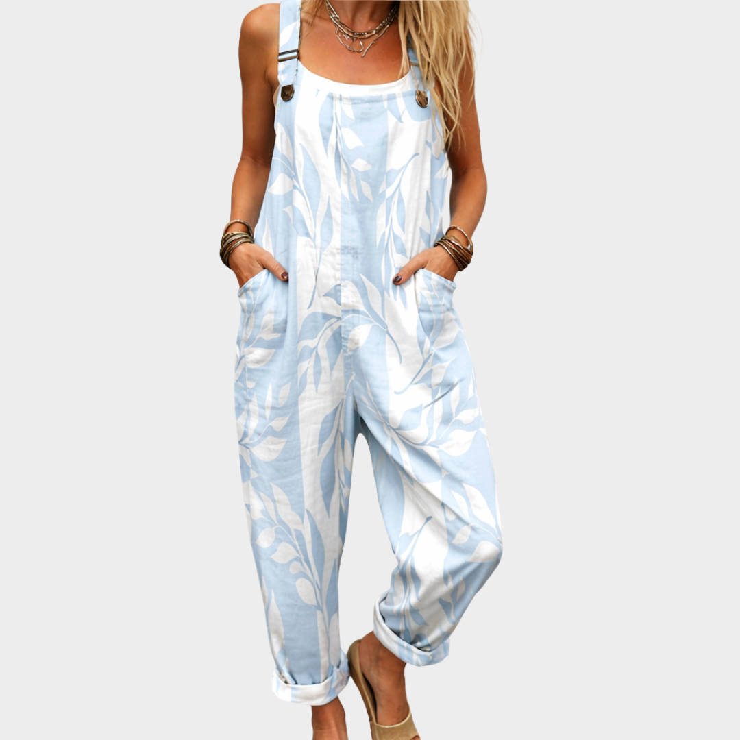 Light blue leaf-print relaxed fit overall jumpsuit with button straps and front pockets