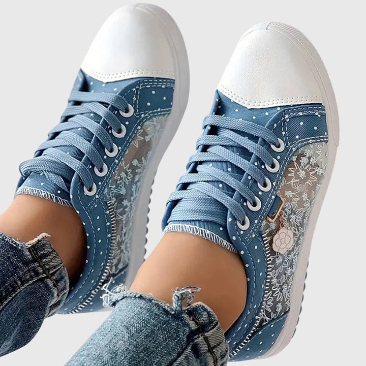 Light blue and patterned lace-up casual sneakers with white toe and thick sole