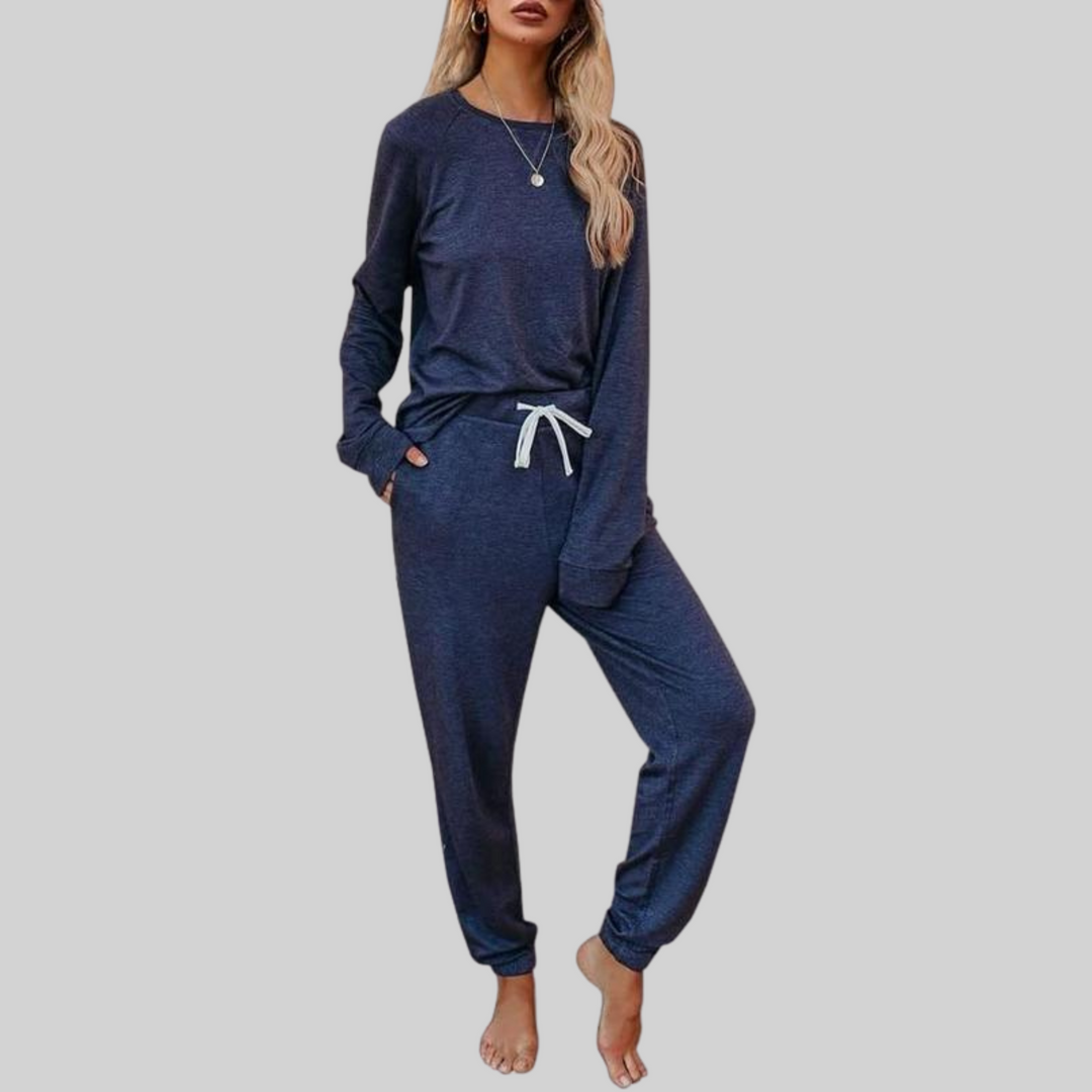 Blue cozy lounge set: crewneck long-sleeve top and jogger pants with white drawstring.