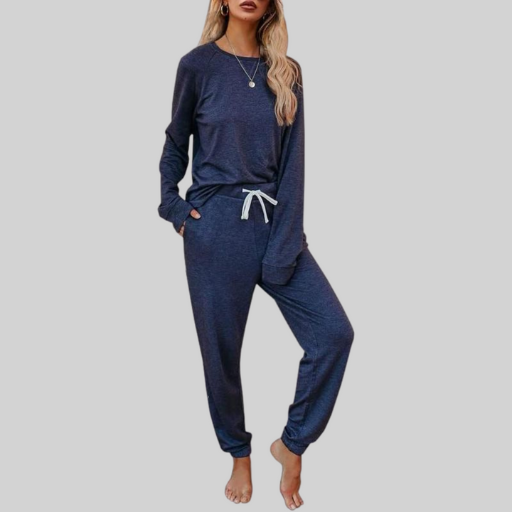 Blue cozy lounge set: crewneck long-sleeve top and jogger pants with white drawstring.