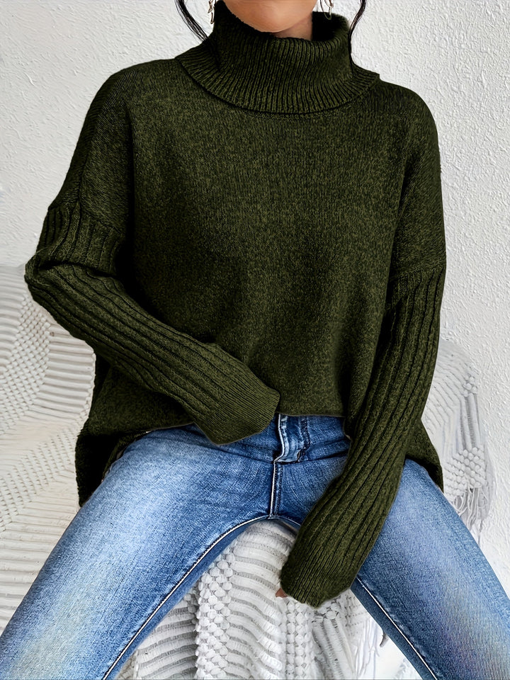 Olive green oversized turtleneck sweater with ribbed sleeve cuffs and relaxed drape, curved hem
