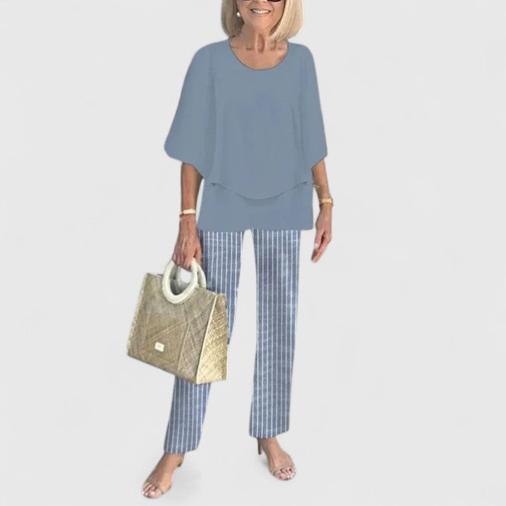 Two-piece blouse and trouser set with slate blue blouse and blue pinstripe trousers