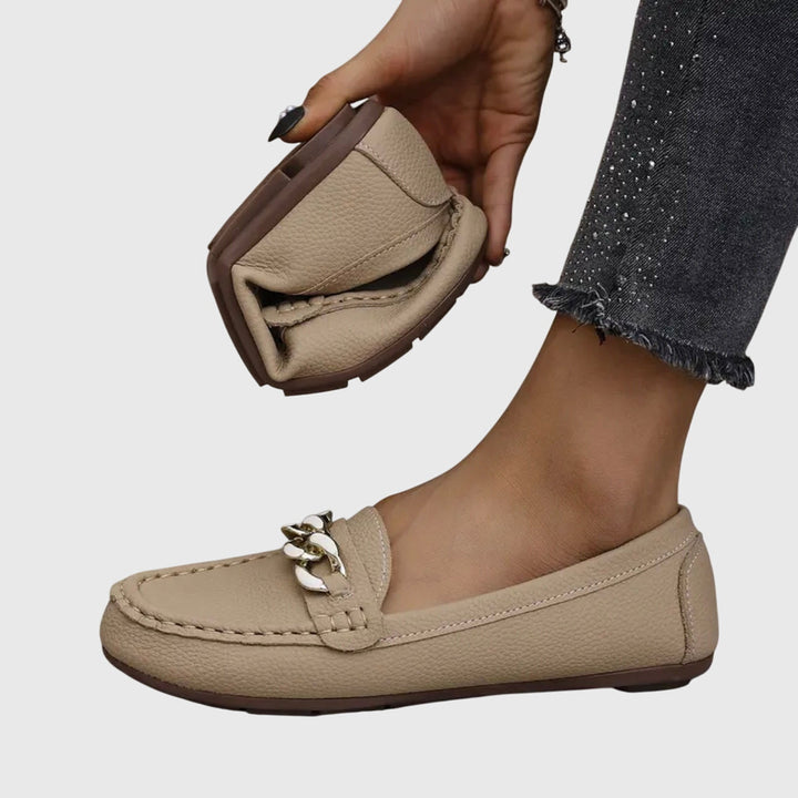 Kris beige chain-detail slip-on loafers with metal link ornament and moc-toe stitching