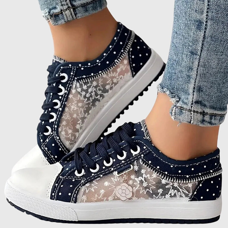 Dark blue lace-up casual sneakers with star and dot print, white toe cap and sole