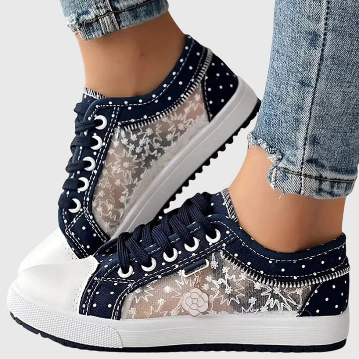 Dark blue lace-up casual sneakers with star and dot print, white toe cap and sole