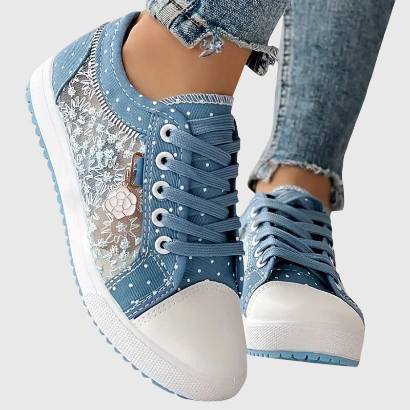 Light blue lace-up casual sneakers with floral charm, star dots and white rubber toe