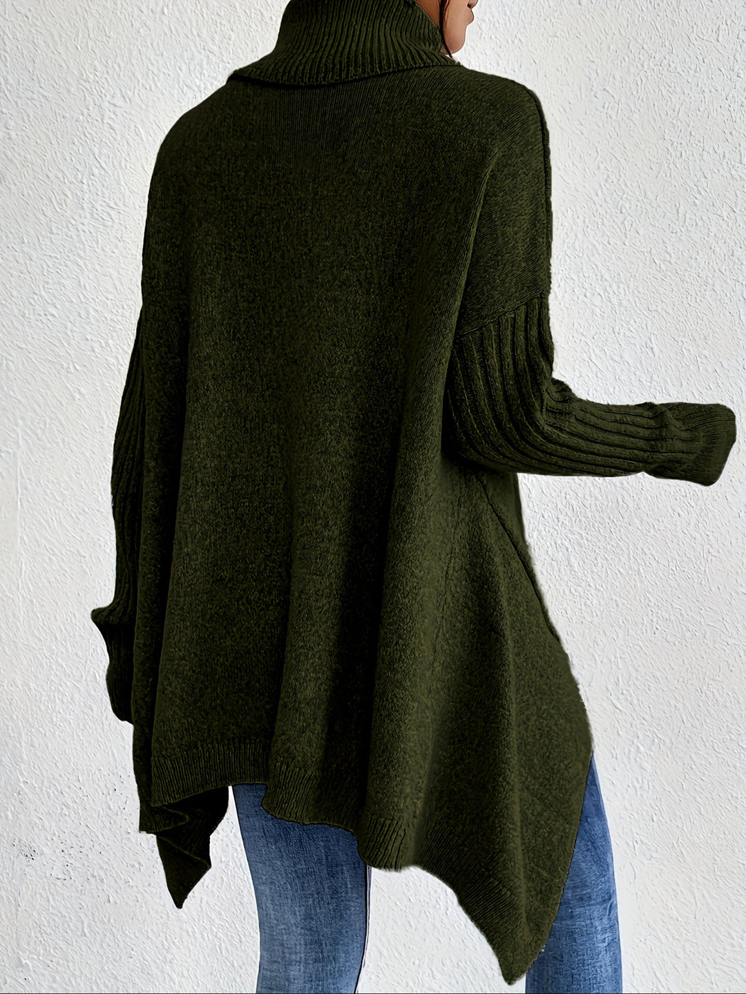 Olive green oversized turtleneck sweater shown from back, ribbed cuffs and high-low hem