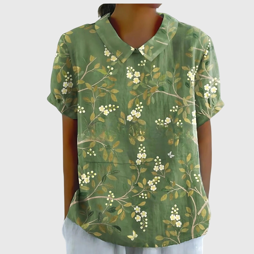 Floral collar blouse in deep green with scattered white flower print, short sleeves