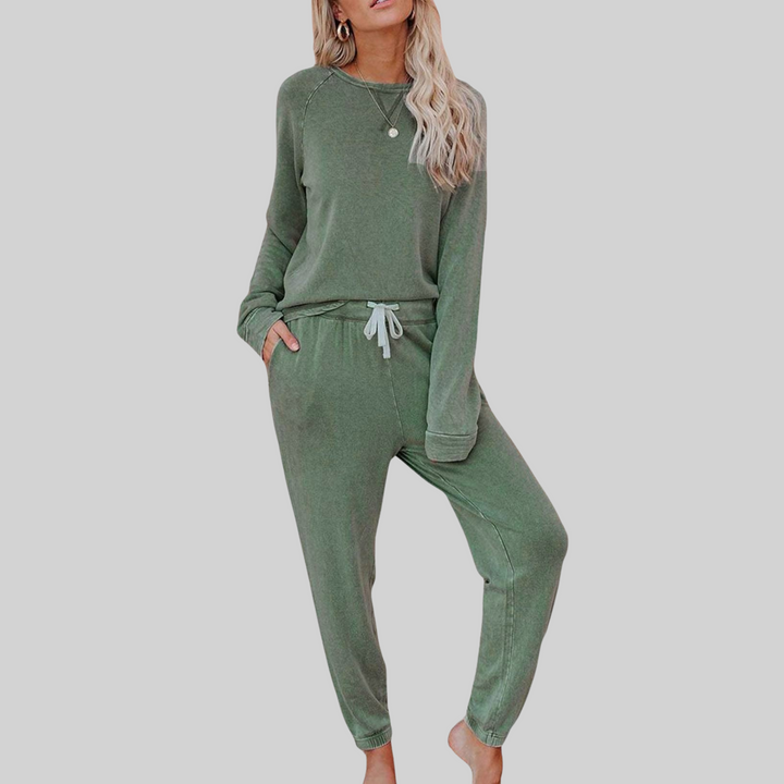 Green cozy lounge set: crewneck long-sleeve top and jogger pants with white drawstring.