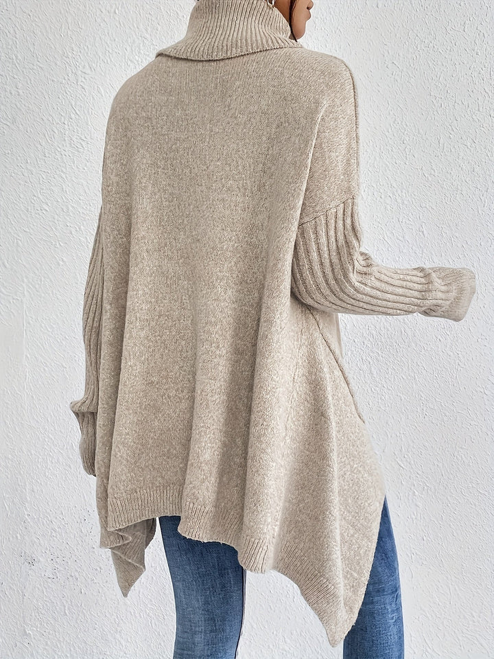 Oversized turtleneck sweater in light knit from back view, ribbed cuffs