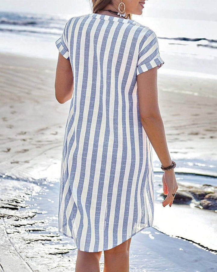 Blue-and-white striped shirt dress with short sleeves and button front, back view