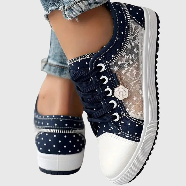 Dark blue lace-up casual sneakers with flower charm, dotted star pattern and white sole