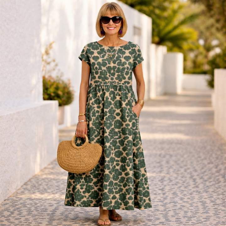 Floral maxi dress with short sleeves and tiered waist, deep green and light leaf print