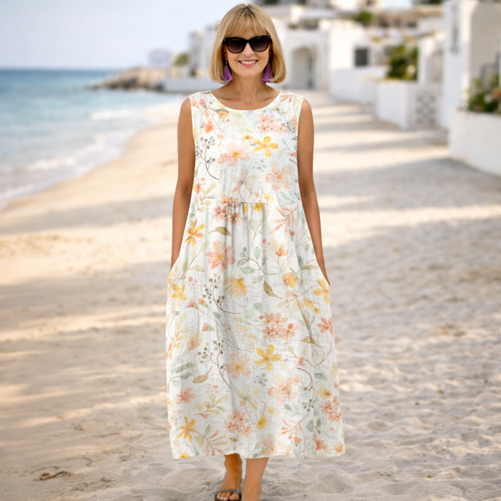 White floral midi dress with sleeveless round neck and gathered skirt