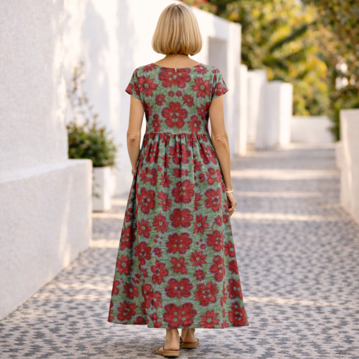 Floral maxi dress back view with short sleeves and tiered skirt, red and green print